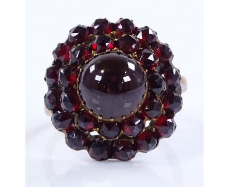 An unmarked gold faceted garnet cluster ring, setting height 21.2mm, size O1/2, 4.4g