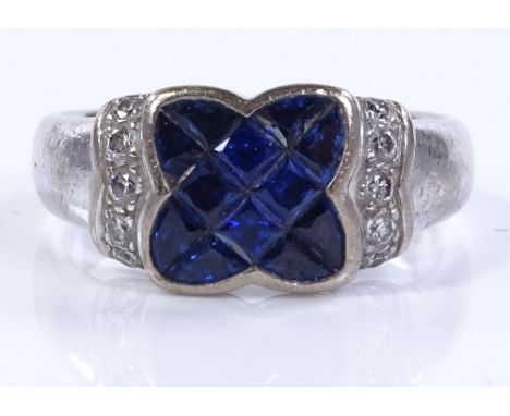 An 18ct white gold sapphire and diamond cluster dress ring, setting height, size N, 7.3g