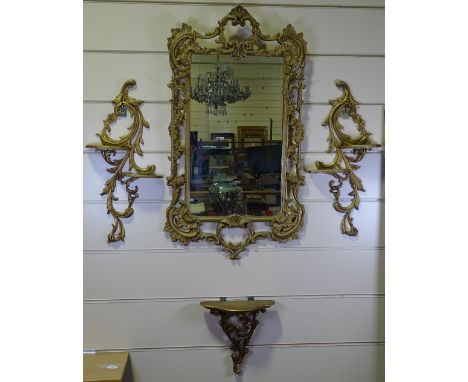 An ornate gilt-metal framed wall mirror, height 102cm, and 3 matching wall shelf brackets, mid-20th century