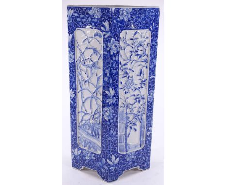 A Chinese blue and white porcelain stick stand of lozenge form, with relief moulded bamboo design panels, height 54cm