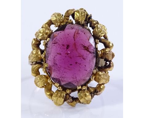 A 9ct gold flat-top garnet flowerhead ring, setting height 25.4mm, size P, 4.4g