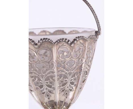 A silver swing-handled rose bowl, with pierced and scroll engraved decoration and glass liner, by Henry Wilkinson &amp; Co, S