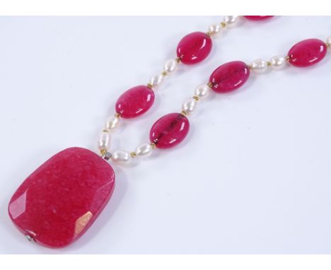 A faceted ruby and pearl necklace