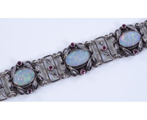 A silver opal and ruby set bracelet, length 17cm, 35.9g