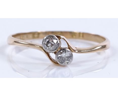 An 18ct 2-stone diamond crossover ring, total diamond content approx 0.2cts, size O1/2, 1.6g