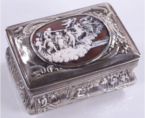 A Dutch silver table snuff box, with inset relief carved cameo, embossed hunting scene border and farming scene base, length 