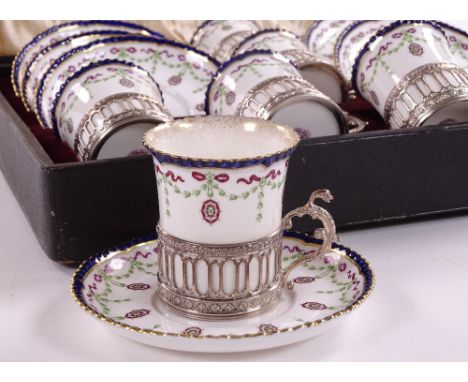 An Edwardian Royal Worcester silver-mounted coffee service, hallmarks Birmingham 1907, in original fitted case
