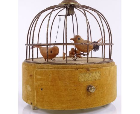 A Japanese clockwork automaton bird in a cage, with drawer fitted base