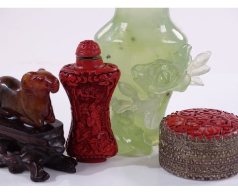 A group of Oriental items including a carved jade ram, length 5.5cm, a jade vase and cover, and cinnabar items