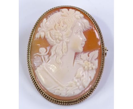 A relief carved cameo brooch, depicting a Classical female portrait, 9ct gold frame, brooch height 38mm, 8.3g