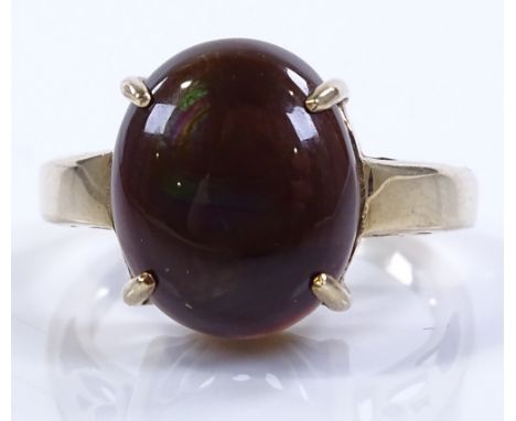 A 9ct gold brown ammolite set ring, setting height 13mm, size L1/2, 4.8g