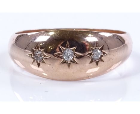 A 9ct rose gold 3-stone diamond gypsy ring, setting height 8mm, size R, 3.3g