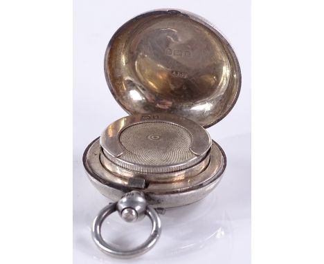 A circular silver sovereign case, with engine-turned decoration, by Dennison, Wigley &amp; Co, Birmingham 1906, diameter 3.2c