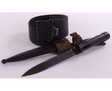 A Falklands War period bayonet with scabbard and canvas frog, together with an Argentinian canvas belt (2)