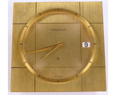 A Jaeger-LeCoutre 8-day desk clock, brushed brass frame with date aperture, case no. 465, width 114mm, working order 