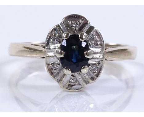 A 9ct gold sapphire and diamond cluster ring, setting height 11.1mm, size N, 3.4g