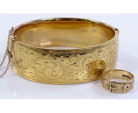 A 9ct gold buckle design ring, size M, together with a gold plated hinged bangle (2)