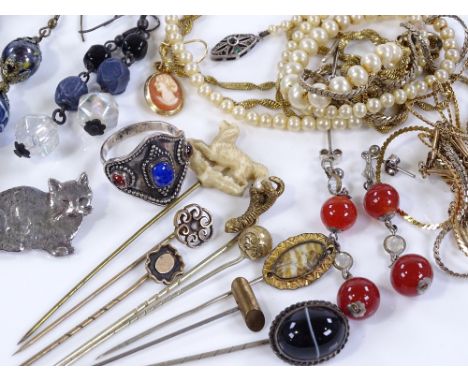 Group of various jewellery, including stick pins, chains and brooches