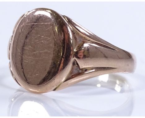 A 9ct rose gold oval signet ring, setting height 14.2mm, size T1/2, 5.5g