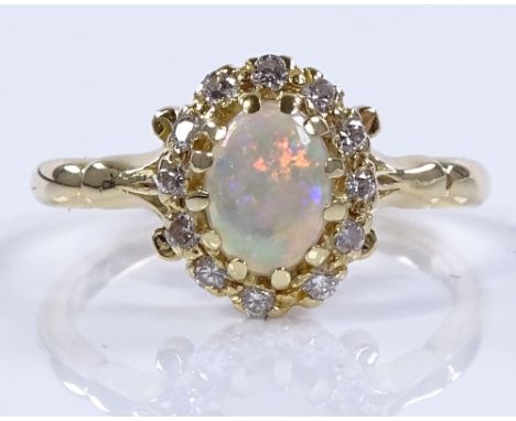 An 18ct gold opal and diamond cluster ring, setting height 10.4mm, size L, 3.1g