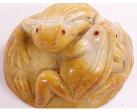 A Chinese relief carved yellow jade boulder carving, surmounted by 2 frogs, length 13.5cm