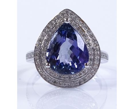 A 14ct white gold tanzanite and diamond set cluster ring, pear-cut tanzanite approx 4.45cts, total diamond content approx 0.7