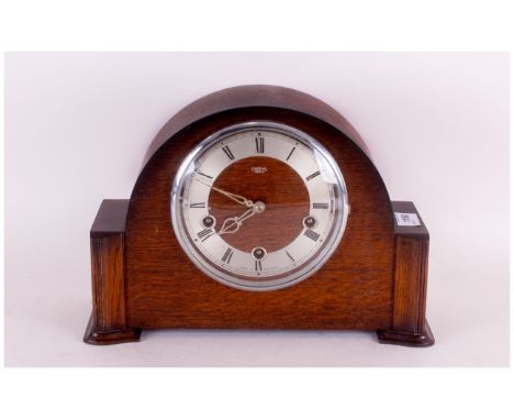 1930's Oak Westminster Chime Napoleon Hat Mantle Clock, with a round steel chapter dial. 10 inches in height.