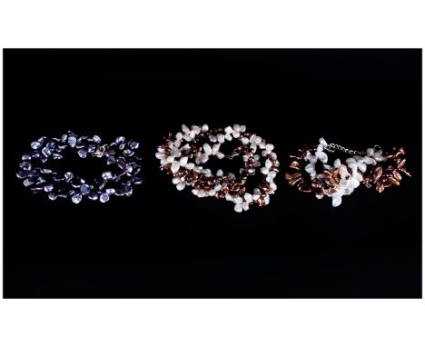 Two Various Keshi Pearl Necklaces comprising a single strand peacock keshi necklace and a double strand, one white and one co