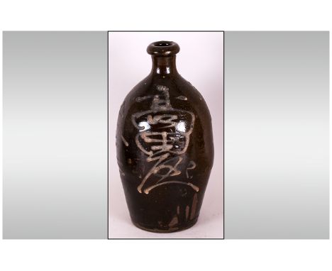 Japanese Late 19th Century Salt Glazed Stoneware Sake Bottle of Tapered Ovoid Form, with cylindrical neck and rolled lip, dec