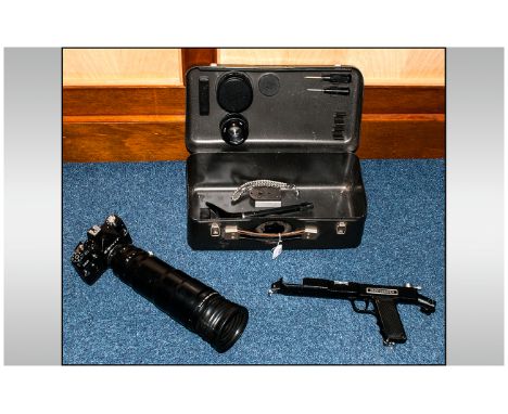 A Zenit 12S Camera and Long Range Lens in metal fitted box. Complete with extra lenses and instruments.