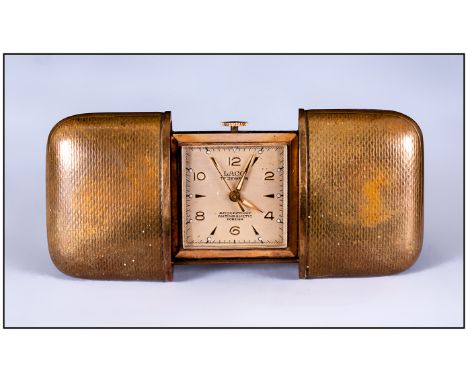 1940's Laco Travelling Clock, manual wind. Ticking but not tested for accuracy,