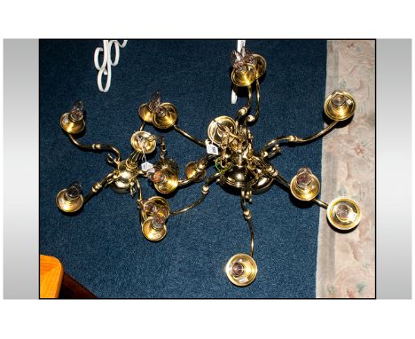 Two Brass Ceiling Light Fittings comprising one five branch chandelier and one 9 branch chandelier.