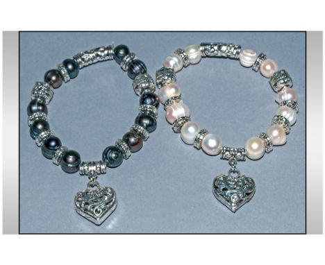 Pair of Fresh Water Pearl Charm Bracelets, one white and one peacock pearl, both interspersed with rondelles and filigree tub