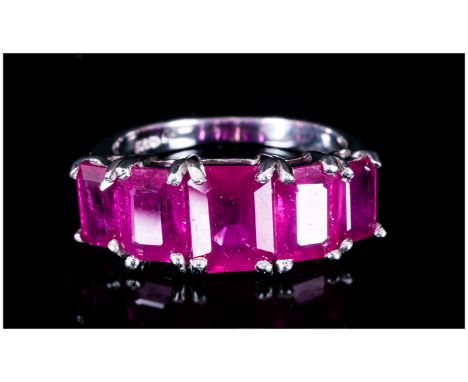 Ruby Five Stone Ring, 6.85cts of octagon cut, graduated rubies of good colour, set in a continuous row across the finger,in s