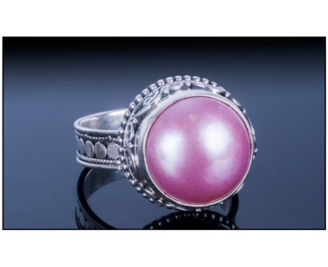 Pink Fresh Water Mabe Pearl Ring, the 14mm solitaire pearl which has developed with a flat underside due to it's position in 