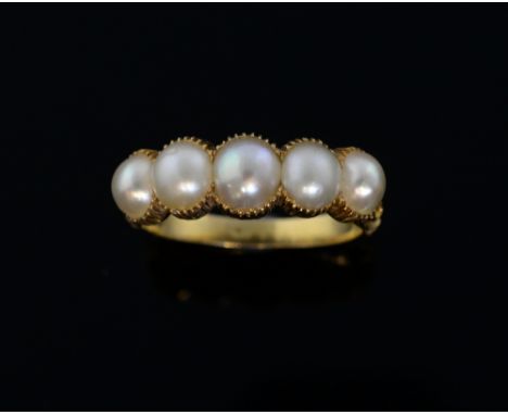Georgian pearl set ring, collet set with five half pearls, the shoulders with floral forms, gold unmarked Provenance, a histo