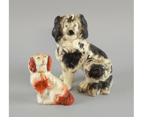Well modelled 19th century Staffordshire seated Spaniel with black ears tail and blotches, front legs separated,  14cm high 1