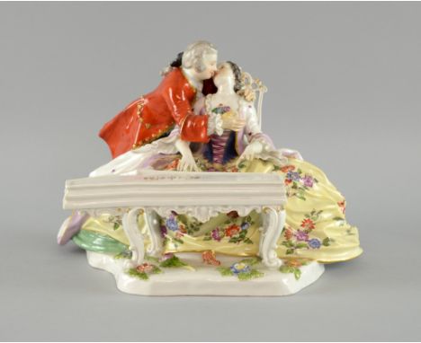 Late 19th century Meissen study of two young lovers embracing she playing a spinnette Model 756 16cm high 