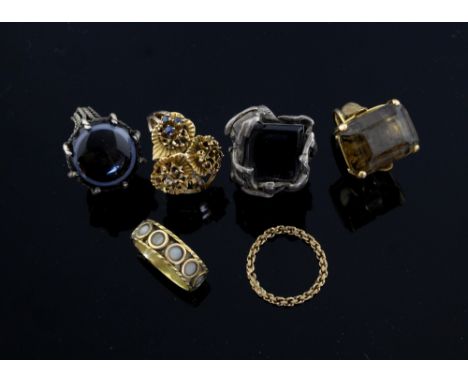 Gold and silver dress rings, one in Roman style, inset with circles of agate stamped, K H, a smoky topaz set ring , two gold 