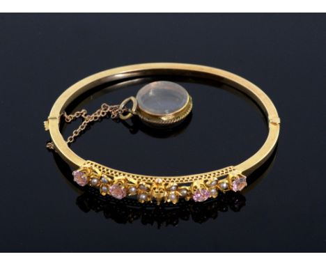 Edwardian hinged bangle, with pink tourmalines and seed pearls. mounted in 15ct gold. Circa 1910