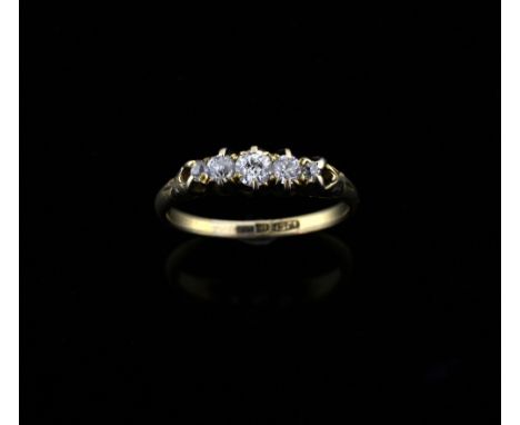 Victorian five stone diamond ring,  in claw set mount with scroll decorated shoulders, 18 ct gold 