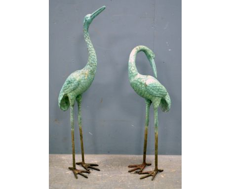 Pair of 20th century bronze effect storks, 80cm high,