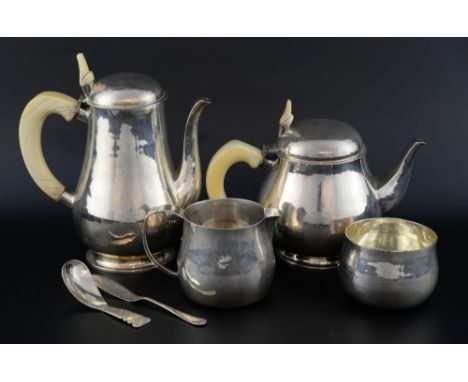 Anglo-Indian white metal pear shaped four piece tea service with hammered decoration and ivory handles and finials, similar c