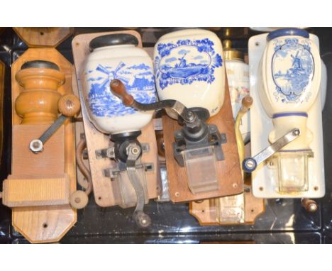 Three ceramic canister wall mills and five wooden examples,