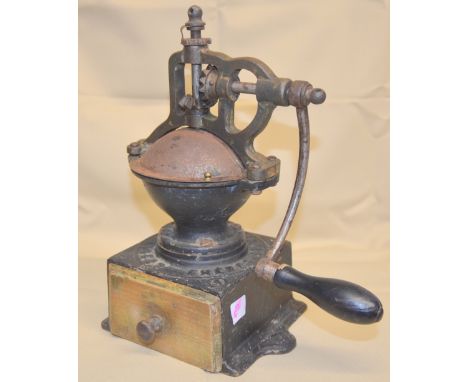 The following 57 lots comprise a single owner collection.Peugeot black cast iron, side cranked box mill with closed hopper an