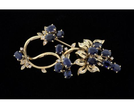 Sapphire and diamond spray brooch, openwork design set with fourteen oval-cut sapphires and diamonds mounted in yellow gold t