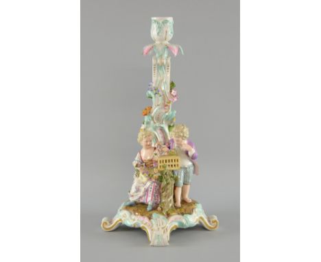 Late 19th century  Meissen candlestick decorated with two young children with a bird cage on a scroll base, Model 786 32cm 