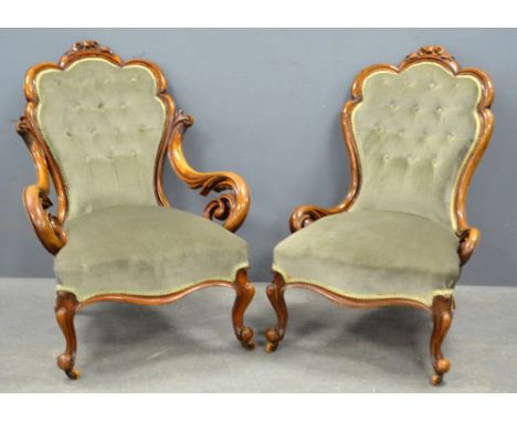19th century walnut armchair with carved floral top rail and foliate arms, with button back and padded seat on cabriole legs 