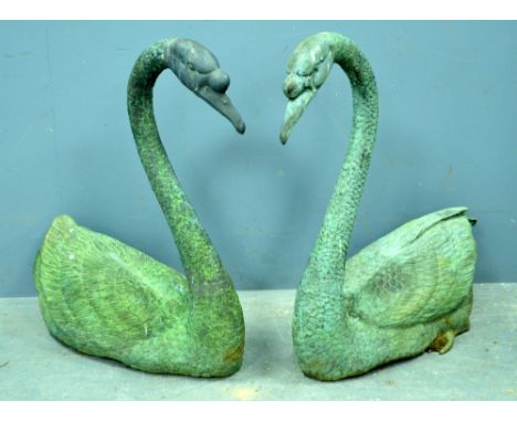 Pair of 20th century bronze effect swans, 75cm high,