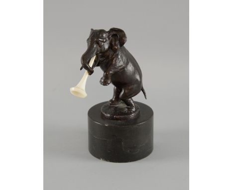 Franz Bergman bronze of an 'Elephant playing a trumpet' on a black marble base, signed, 20cm high,